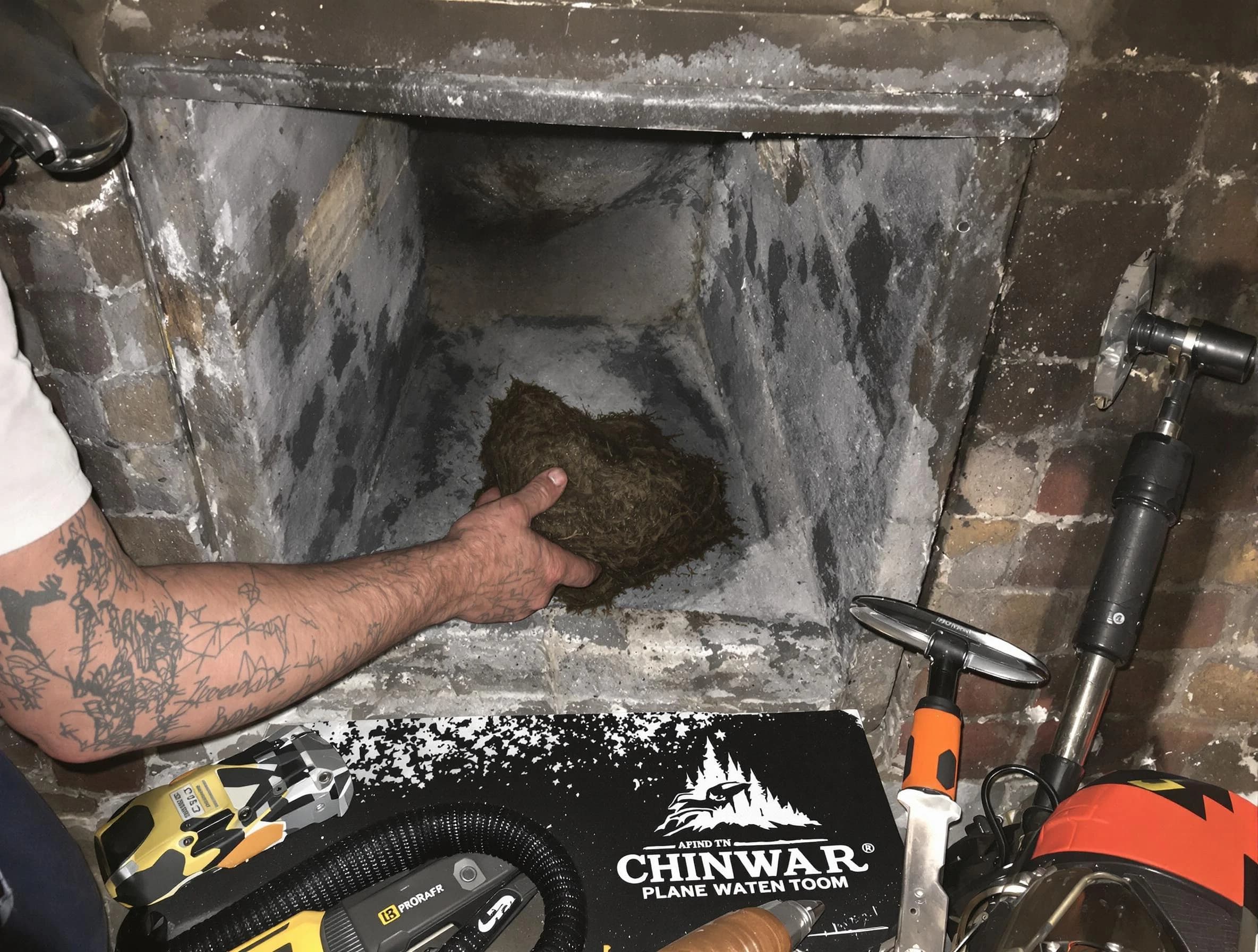 Clifton Chimney Sweep safely removing debris and screening chimney in Clifton, NJ